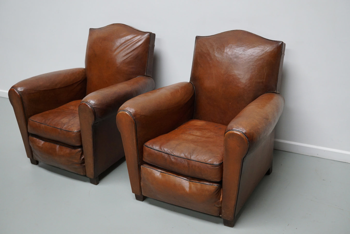 Pair of French Cognac Moustache Back Leather Club Chairs, 1940s