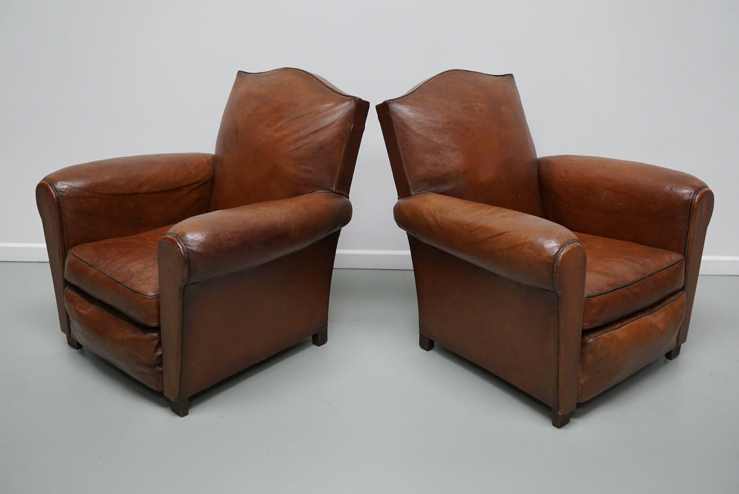 Pair of French Cognac Moustache Back Leather Club Chairs, 1940s