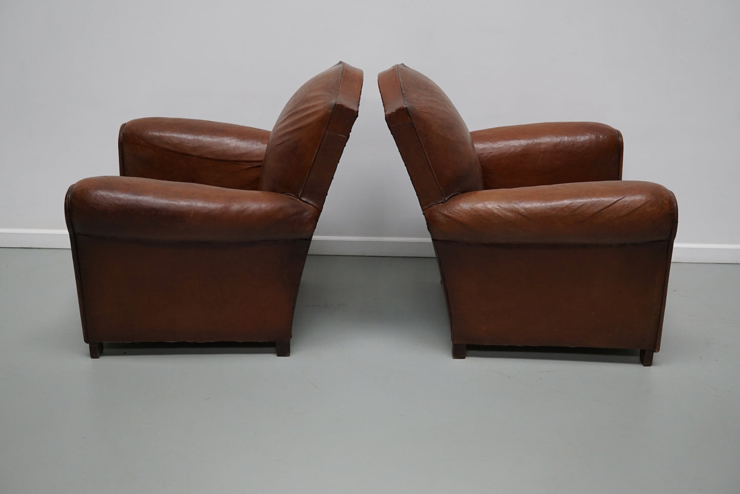 Pair of French Cognac Moustache Back Leather Club Chairs, 1940s