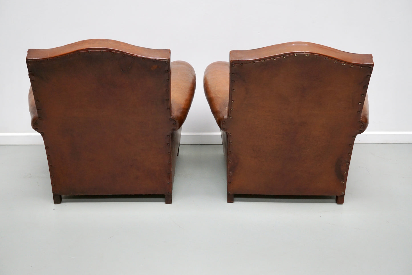 Pair of French Cognac Moustache Back Leather Club Chairs, 1940s