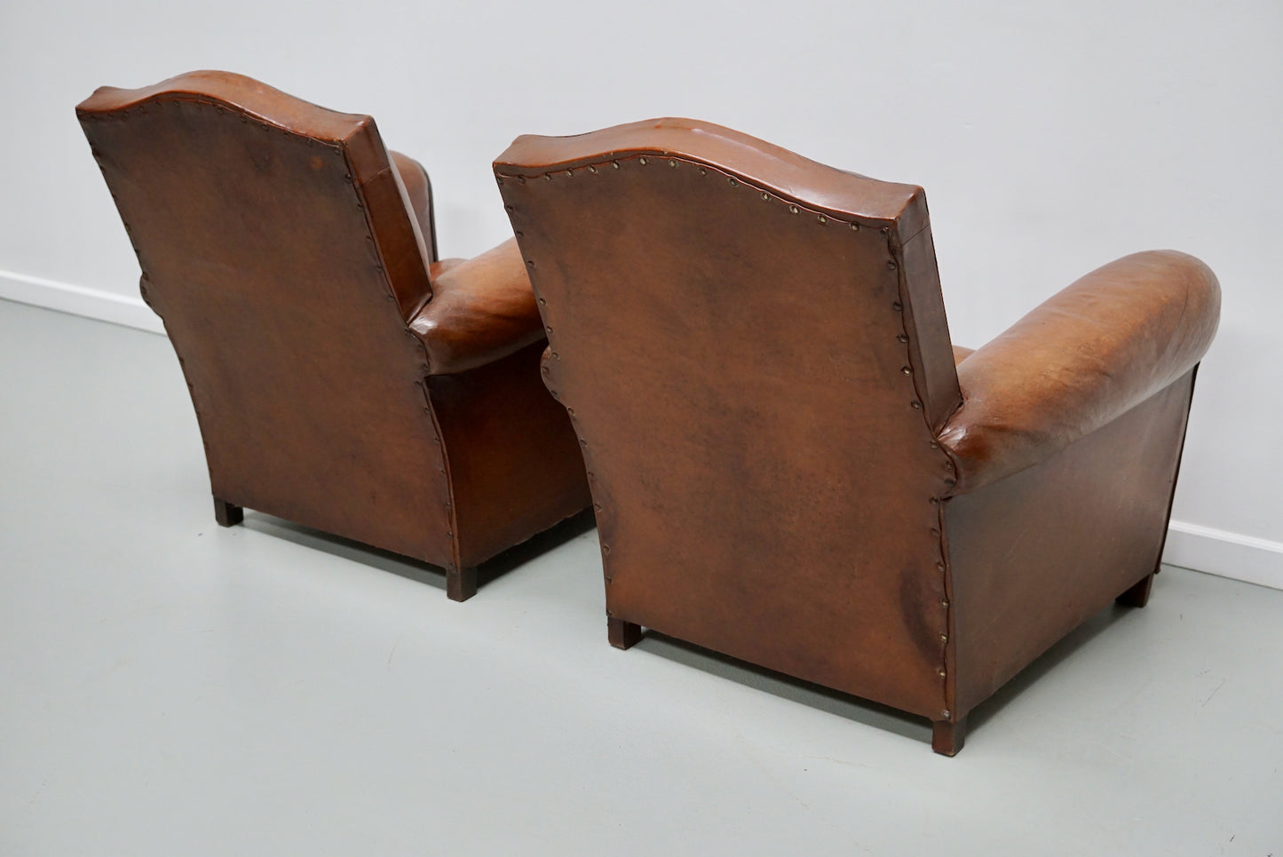 Pair of French Cognac Moustache Back Leather Club Chairs, 1940s